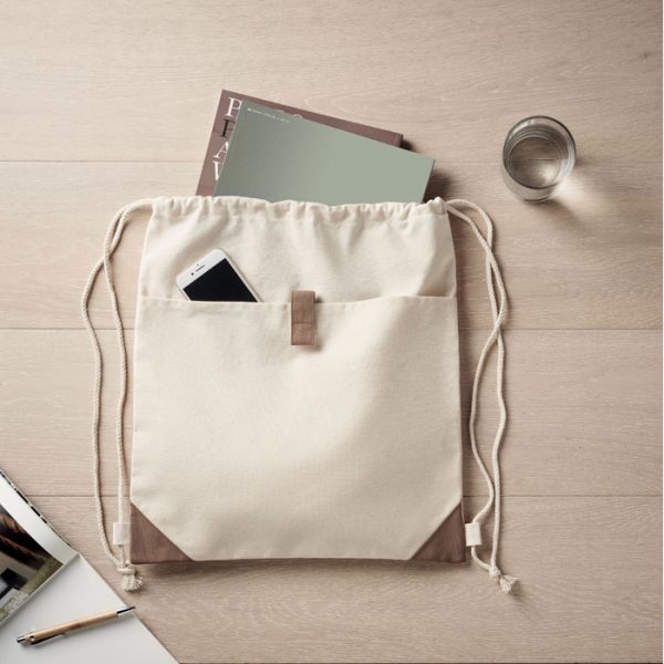 Eco-friendly beige drawstring bag made from recycled cotton, perfect for everyday use.