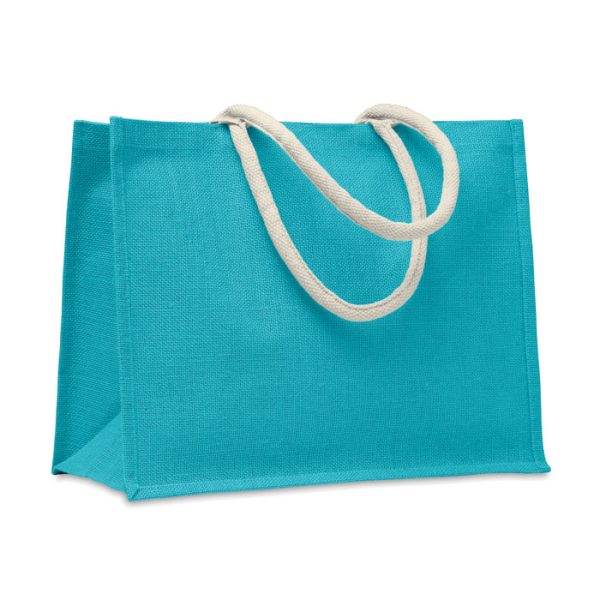 A vibrant turquoise jute bag featuring durable cotton handles, perfect for eco-friendly shopping and everyday use.