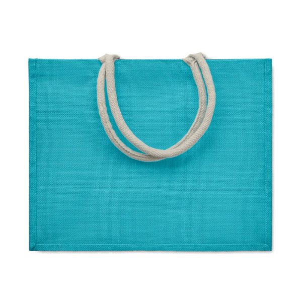 A stylish blue jute bag featuring durable cotton handles, perfect for eco-friendly shopping or everyday use.