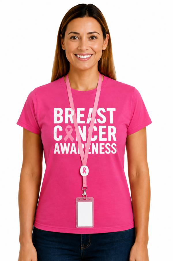 awareness 2 GiftSuppliersae Corporate Gifts UAE | Branded Merchandise | Uniforms Smiling woman in a pink Breast Cancer Awareness T shirt wearing a pink lanyard and ID badge